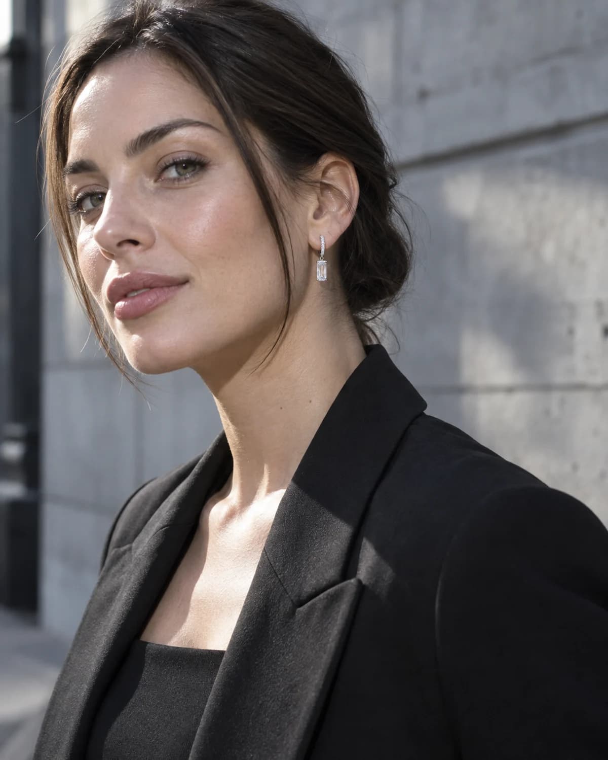 Contemporary drop earrings styled with a relaxed black blazer for a city day
